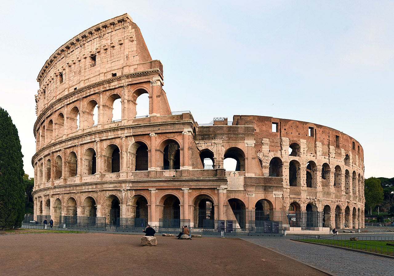 Photos Roman Coliseum, or Flavian Amphitheater, this massive stone amphitheater is believed to have been commissioned by Emporer Vespasian as a gift to the Roman people in the first century A.D. It was first used for watching gladiators in combat