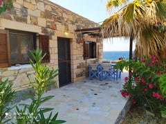 This stone beach house is perfect for relaxation and isolation. Only 15 minutes   The hidden gem of Papadiokampos. Sea & relaxation. Entire home vacation rental 44279051