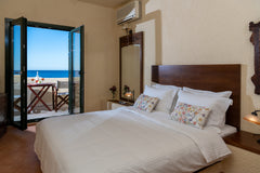 Situated directly on the sea, on rocky seashore, in the small fishing village of Sisi, Greece Porto Sisi Charming Maisonette by The Sea Room in serviced apartment vacation rental 11874767