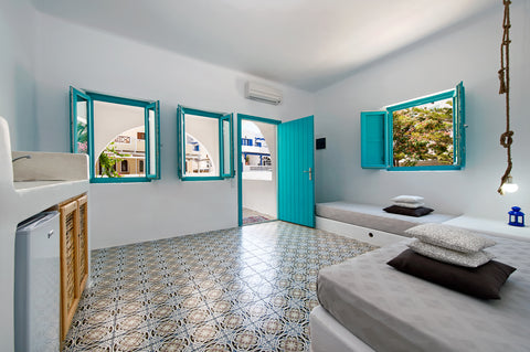 Apartment: a queen size bed in the main bedroom, living room with sitting area a Thira, Greece Family apartment with breakfast close to the beach Room in aparthotel vacation rental 1686362