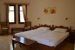 Cozy studio with a kitchenette, two single beds, a couch, a bathroom and two bal Greece Giorgos and Maria, Cozy studio Private room in serviced apartment vacation rental 21269714