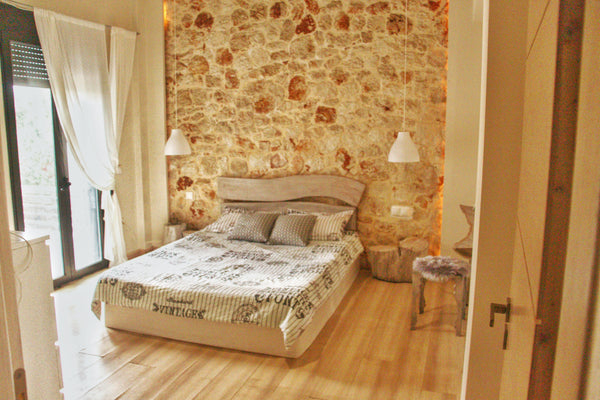 Spacious and bright, our house is 5 min away from the beach . The window wall of Chania, Greece Mediterraneo. Stylish stone house garden & veranda Entire home vacation rental 33492397