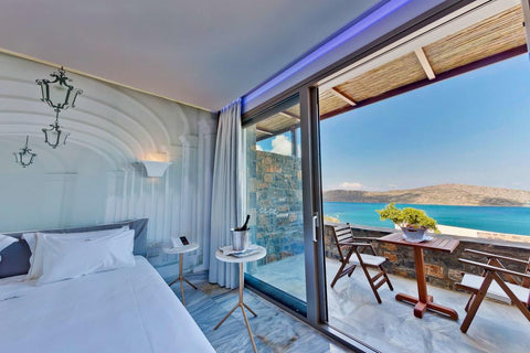 "Located right on the beach in Elounda, Royal Marmin Bay Boutique & Art Hotel fe  We offer a pleasant holiday in a beautiful setting Room in aparthotel vacation rental 24664308