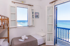 Embraced by the picturesque scenery of Tinos Island in Greece, “Kyma Holiday Mai  Luxury Wave  Maisonette - Ormos Isternion Tinos Cycladic home vacation rental 24495481