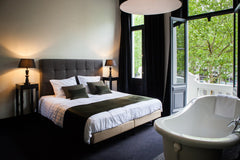 Enjoy a spacious room with three extra-large windows covered by majestic curtain  B in Antwerp-your luxurious getaway in Antwerp! Room in hotel vacation rental 38281297