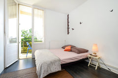 A cute room with balconey but not really good for sound isolation cause the wall Bordeaux, France Stay with a french teacher ! Train station area Private room in rental unit vacation rental 3431762