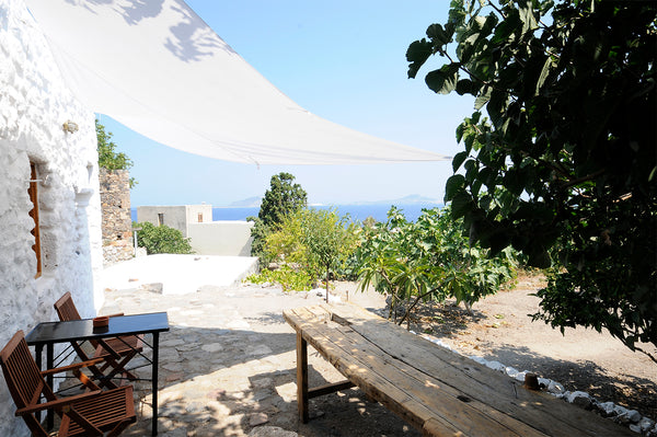 One of three houses at a private field, fifty steps above the center of Mandraki Cholargos, Greece Stone house with sea view Earthen home vacation rental 26422943