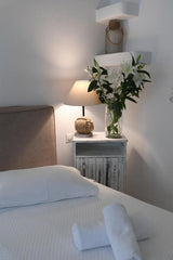 The hotel Vincenzo Family Rooms is centrally located in the country of Tinos, ne Tinos, Greece Top Rated triple Room Room in hotel vacation rental 39188978