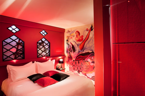 A large-as-life poster from the famous cabaret, the flame-red drapes, and the ti  Moulin Rouge Room - Rainfall Massage Shower Room in hotel vacation rental 24847213