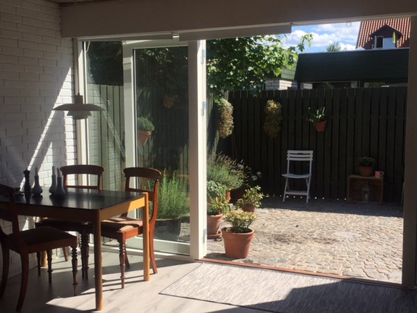 Enjoy your morning coffee or have an evening barbeque in the sunny courtyard of  Copenhagen, Denmark Hyggehouse with free street parking Entire home vacation rental 23225509