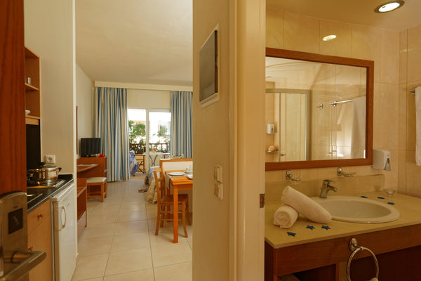 Opening to a balcony or terrace with garden or land view, this air-conditioned s Platanias, Greece Comfortable Clean Studio next to the beach Room in aparthotel vacation rental 31134261