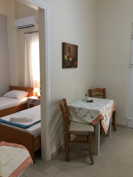One room with 2 single beds and a living room with sofa. The apartment has kitch Heraklion, Greece Heraklion Old Port Apartments (G1) Entire rental unit vacation rental 20612783