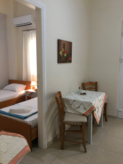 One room with 2 single beds and a living room with sofa. The apartment has kitch Heraklion, Greece Heraklion Old Port Apartments (G1) Entire rental unit vacation rental 20612783
