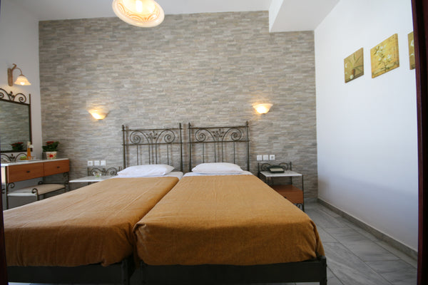 Hotel Iliovasilema is a fully renovated family hotel. Is located in the center o  Triple Room with Balcony Private room vacation rental 12687724