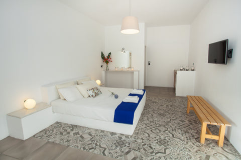 Accommodation situated in Kamari, 20 meters from its volcanic black beach. Tradi Kamari, Greece bed & breakfast by the sea Private room in bed and breakfast vacation rental 11488409
