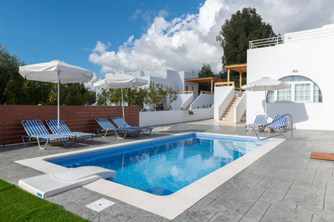 Against the backdrop of rugged mountains, the balcony and terrace views from the Greece VILLA ARETE PEFKOS LINDOS RHODES Entire villa vacation rental 12139545