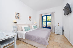 It is a quiet two-bedroom apartment, ideal for families with children, in the Ak Greece Relaxing rooms in Akrotiri santorini & pool RR Room in boutique hotel vacation rental 32649175