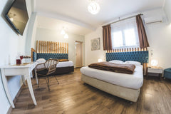 Dome Luxury Rooms are located on the first floor of a renovated building in the   Dome Luxury Rooms | 5. Triple room Room in hotel vacation rental 31136122