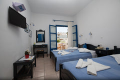 This room has one double and one single bed.  Private bathroom, A/C, direct dial  Triple room for up to 3 persons Room in hotel vacation rental 17967407
