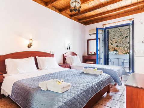 All rooms are sea view with balcony and offer air conditioning, 43" flat TV and  Loutro, Greece Triple with Sea View Room in hotel vacation rental 21729480