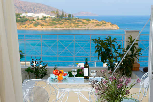 Take a relaxing stroll along the promenade, then dine at your balcony, with the  Agios Nikolaos, Greece Superior Suite with Sea View, Bellevue Suites Entire rental unit vacation rental 19504250