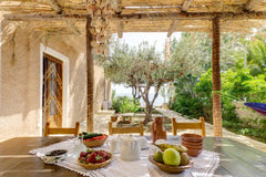 Situated on the edge of a cliff, overlooking a breath taking private sandy beach  Sandy beach & garden ~ Mesodokia home Entire rental unit vacation rental 30270656