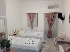 One room with 2 beds, a small kitchen and a toilet. It is located at the old por Greece Studio-apartment with great view Cycladic home vacation rental 24072728