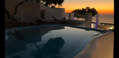 Sunrise-Sunset Cave consists of one bedroom with a queen bed , a common space wi Thera, Greece SUNRISE-SUNSET Dome vacation rental 16281085