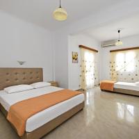 This suite features a bedroom with a white built-in bed, a modern hand-crafted b Greece promo triple Private room in bed and breakfast vacation rental 35929783