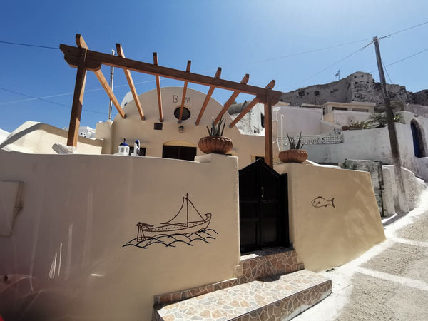At the foot of a medieval castle, at the village of Akrotiri, in Santorini, the   