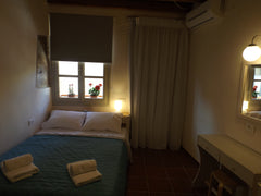 Rooms with air conditioning, fridge, free Wi-Fi and complimentary toiletries. We  Fivos Pension / Double Room with Balcony and View Room in hotel vacation rental 13441503