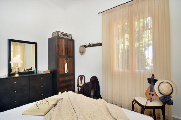 An elevated stone-built ground floor building of a two-storey building, typical   Haralampos Central Apartment Entire home vacation rental 18515666