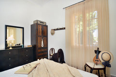 An elevated stone-built ground floor building of a two-storey building, typical   Haralampos Central Apartment Entire home vacation rental 18515666