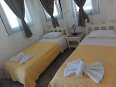 One room (about 30m²) with 3 beds, a small kitchen and a toilet. It is located a Greece Studio-apartment with great view of the castle Cycladic home vacation rental 24072495