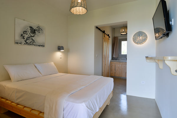 Facing the beachfront in Ándros, Rooster Miniature Apts features a garden.<br /> Athens, Greece Rooster Guesthouse rooms - Family Apartment Entire rental unit vacation rental 30782240