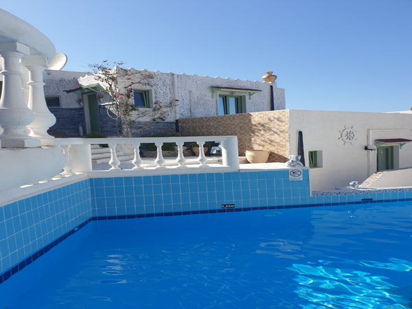 Surrounded by Mediterranean plants and overlooking Hersonissos Bay, this group o  Step into a world of nature One Room Private Suite shared pool Private room in rental unit vacation rental 44023649