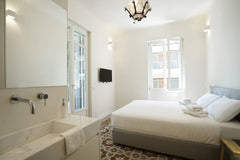 Enjoy a stylish experience at tA fully renovated old Athenian building in to a m GR Plues Suites Athens / E Entire rental unit vacation rental 604038827932670121