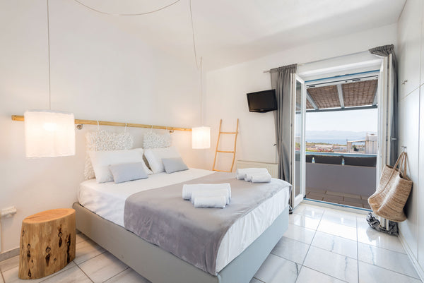 Island Magic is a white washed, luminous house near the beach of Ambelas , with   Island Magic with sea view in Ambelas Cycladic home vacation rental 25933327