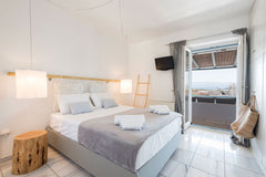 Island Magic is a white washed, luminous house near the beach of Ambelas , with   Island Magic with sea view in Ambelas Cycladic home vacation rental 25933327